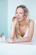 Young woman brushing her teeth in the morning