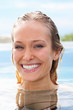 Happy young female with head above the water
