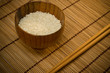white rice in bowl on wooden mat white rice in bowl on wooden mat