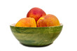 Three peaches in a green, wooden bowl Three peaches in a green, wooden bowl