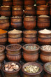 Beautifully carved handmade pots full of aromatic spices on the