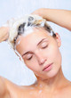 pretty young woman washing her hair