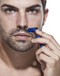 young man shaving. young man shaving.