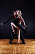 dancers in ballroom against black background dancers in ballroom against black background