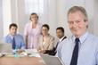 Portrait of businessman  and his team.