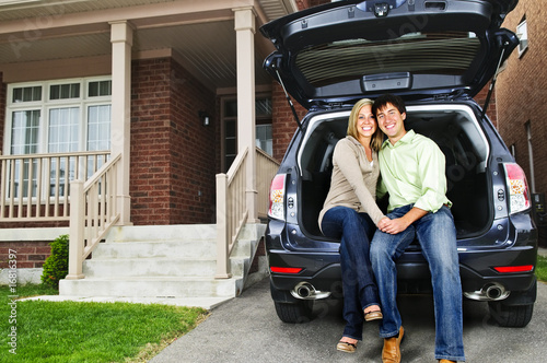 Photo: Couple sitting in back of car Couple sitting in back of car