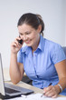 Beautiful businesswomen speaking by mobile phone