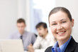 Beautiful woman on the background of business people