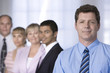 Portrait of businessman and his team.
