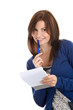 Young woman does records by pen in notepad smiling