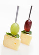 Cheese canape with grape and mint isolated on white Cheese canape with grape and mint isolated on white