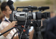 business conference camera journalism