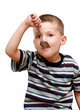 little boy with a spoon in mouth