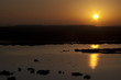 Beautiful African sunrise, reflected on lake in Kenya.