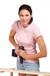 young women working with cordless screwdriver