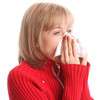 Woman sneezing