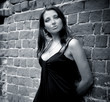 Charming woman near the wall