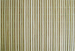 Bamboo perfectly arranged into a wall with silk thread