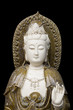 kuan yin statue on black background