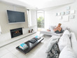Woman relaxing on the sofa in her home having a beverage