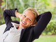 Relaxed mature business woman sitting on a chair