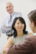 Businesswoman meeting with staff members