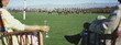 Couple drinking champagne, sitting watching polo