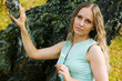 Beautiful young woman with daisy.