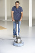 Photo: Cleaner polishing office floor Cleaner polishing office floor