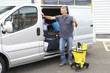 Photo: Cleaner standing next to van Cleaner standing next to van