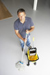 Photo: Cleaner mopping office floor Cleaner mopping office floor