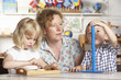 Photo: Adult Helping Two Young Children at Montessori/Pre-School Adult Helping Two Young Children at Montessori/Pre-School