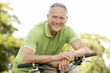 Portrait of man riding cycle in countryside Portrait of man riding cycle in countryside