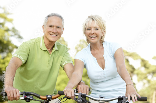 Mature couple riding bikes Mature couple riding bikes
