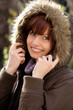 Portrait of beautiful young woman wearing fur hood