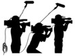 Cameraman at work silhouettes side view