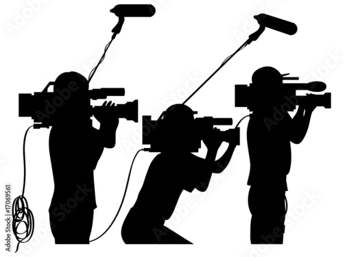 Cameraman at work silhouettes side view