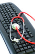 Computer virus concept with keyboard and stethoscope Computer virus concept with keyboard and stethoscope