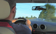 Foto: Man driving a car Man driving a car