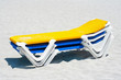 Photo: A stack of beach chairs in the sand A stack of beach chairs in the sand