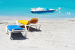 Photo: Beach chairs and a water bicycle in the beach Beach chairs and a water bicycle in the beach