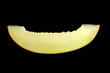 Ripe melon slice isolated on black background