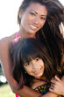mom and daughter posing
