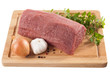 Raw beef on cutting board isolated on white background