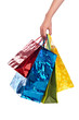 Photo: female hand holding colored bags female hand holding colored bags