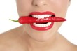 Beautiful woman teeth eating red pepper Beautiful woman teeth eating red pepper