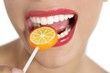 Colorful Lollypop in perfect woman teeth Colorful Lollypop in perfect woman teeth