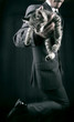 businessman in grey suit and striped kitten in his hands. Ñlose-