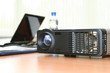 Foto: Computer projector and laptop on table in boardroom Computer projector and laptop on table in boardroom