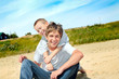 happy teenager and kid on the beach